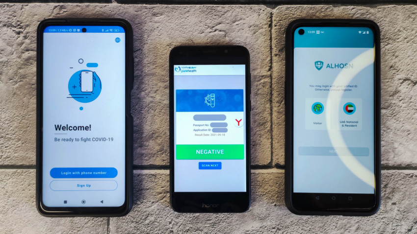 Три смартфона с приложениями для контроля COVID-19 в ОАЭ