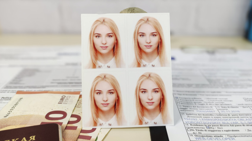 Фото на документы на фоне бумаг и евро