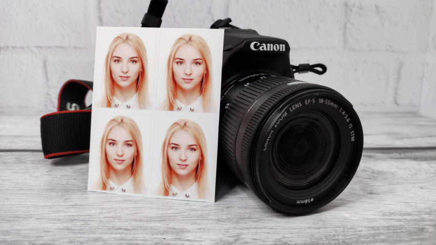Фотоаппарат Canon и отпечатанные фотографии на документы