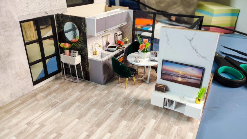 Миниатюрная модель кухни и гостиной в современном стиле