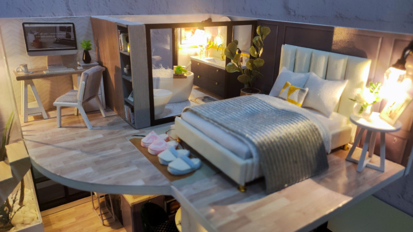 Миниатюрная модель спальни и рабочей зоны с открытой ванной комнатой