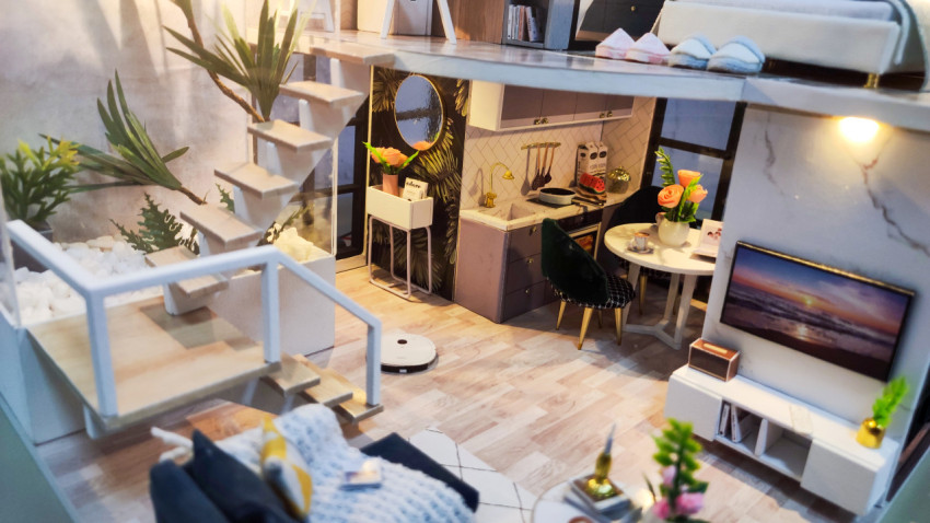 Миниатюрная модель кухни, гостиной и лестницы в современном стиле